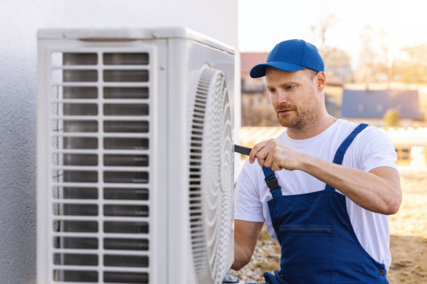 HVAC technician servicing an outdoor air conditioner in South Pasadena